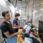Astrobotic employees run the software for a CubeRover ground test in NASA’s lunar regolith pit at the Granular Mechanics and Regolith Operations Laboratory on June 30, 2022. Software developers are one of the most sought-after occupations in the space industry, and the field has a strong employment outlook over the next decade.